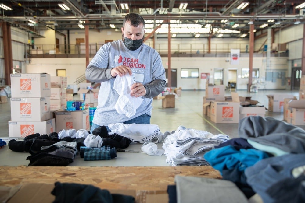 A Team Rubicon volunteer sorting donated supplies
